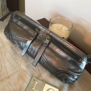 Anderew Mark metallic silver clutch